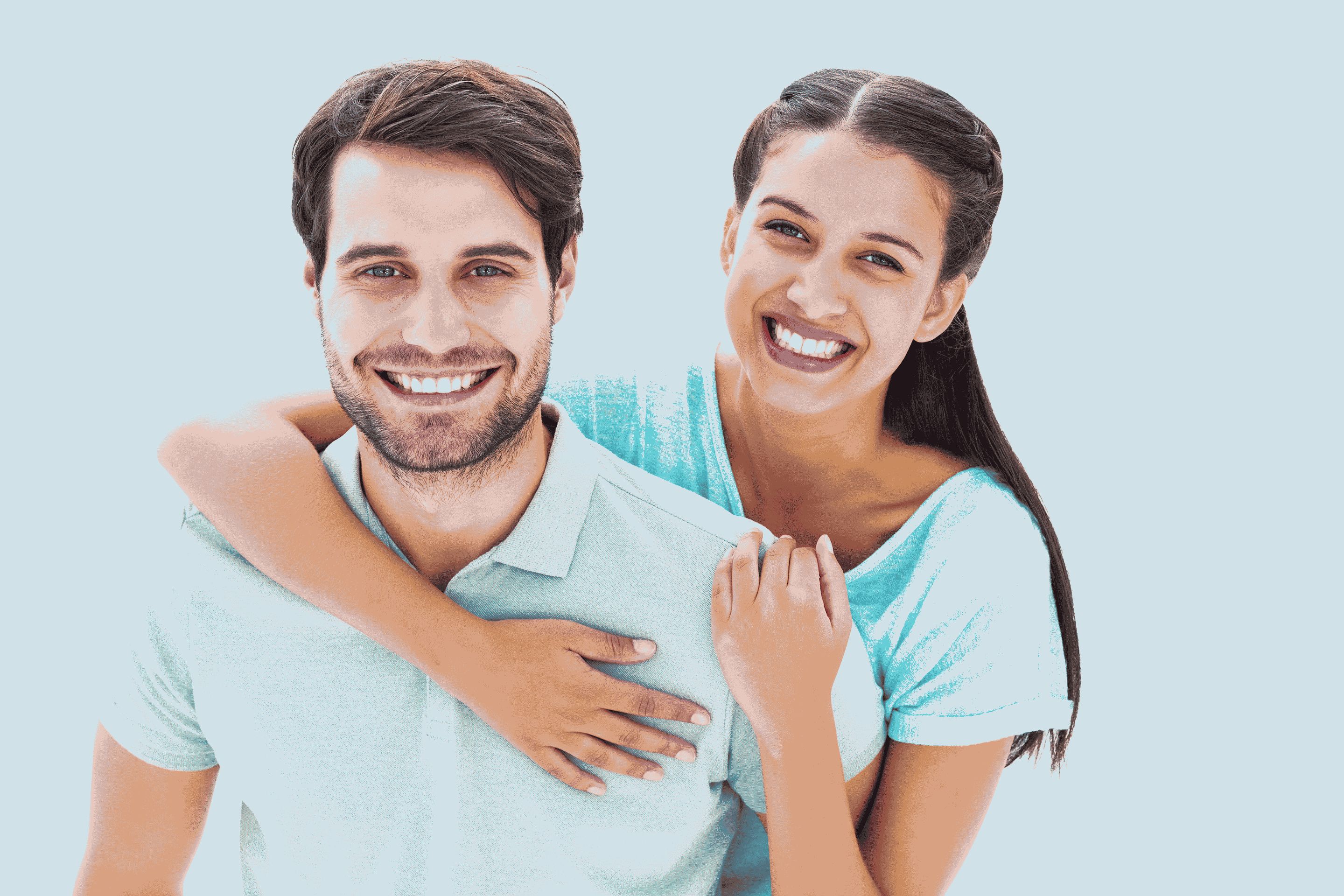 Cute couple smiling at camera on white background